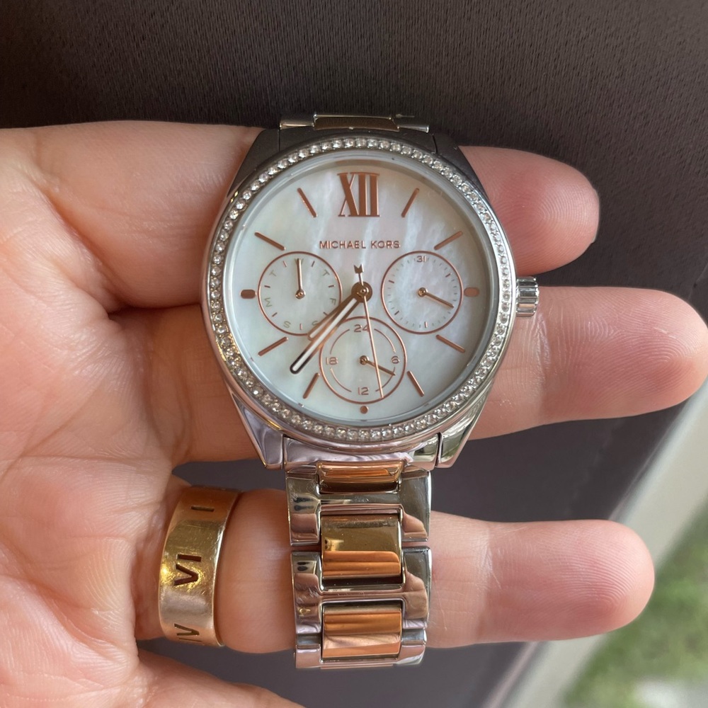 Michael Kors preowned midsize silver and rose gold watch
